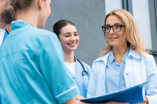 Young nurses talking to a Healthcare professional